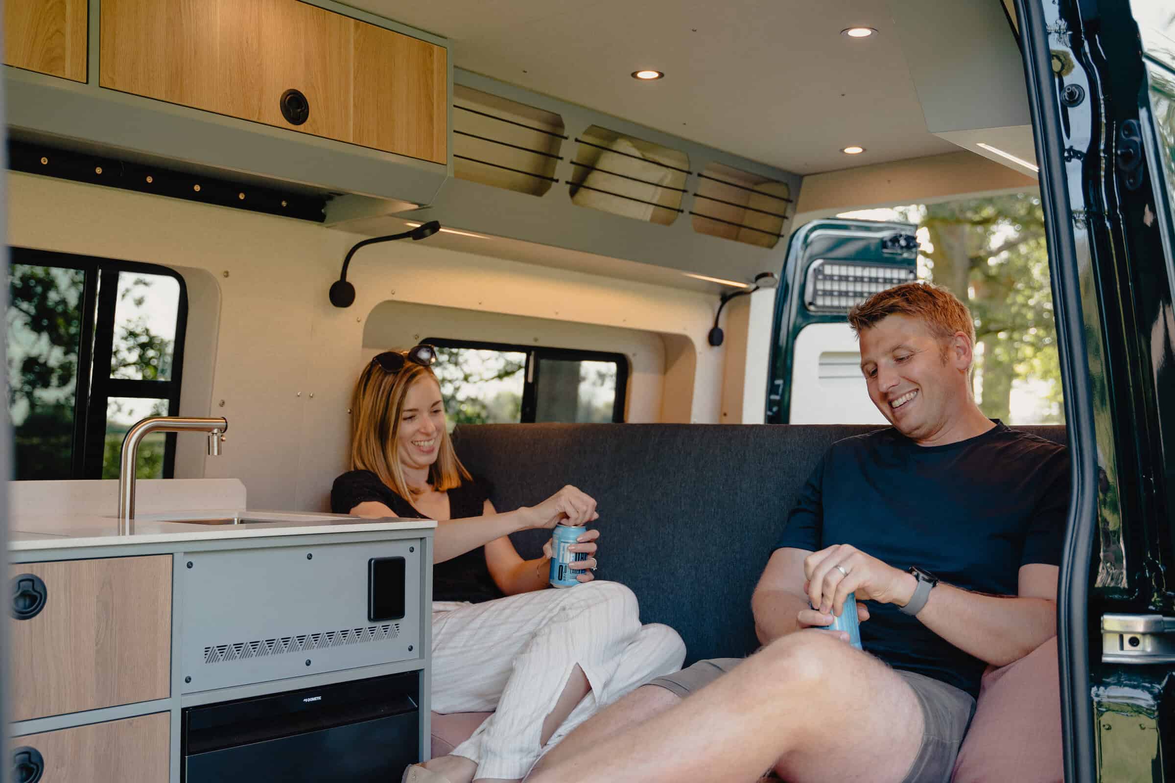 Wide interior of the Onyx Summit campervan — lounge and overhead bed