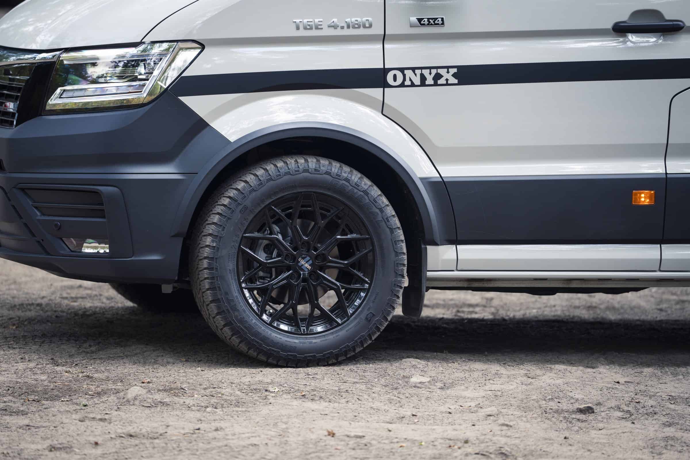 Black alloy wheel and all-terrain tyre on the Onyx Arête MAN TGE 4x4