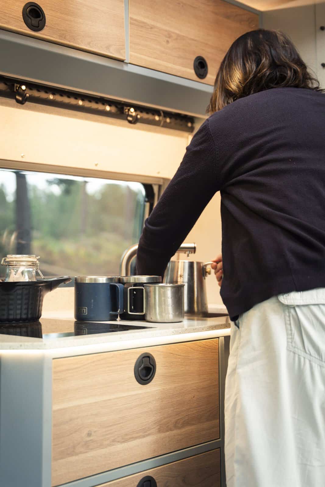 Cooking on the double induction hob in the Onyx Arête kitchen