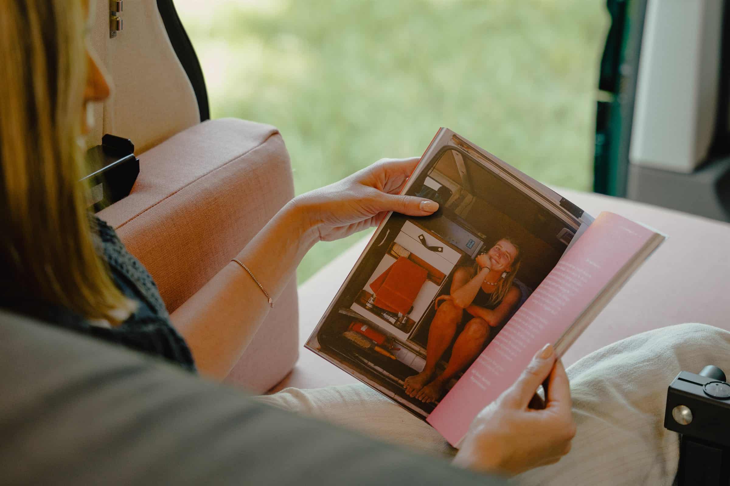 A magazine open on the lounge upholstery in the Onyx Summit