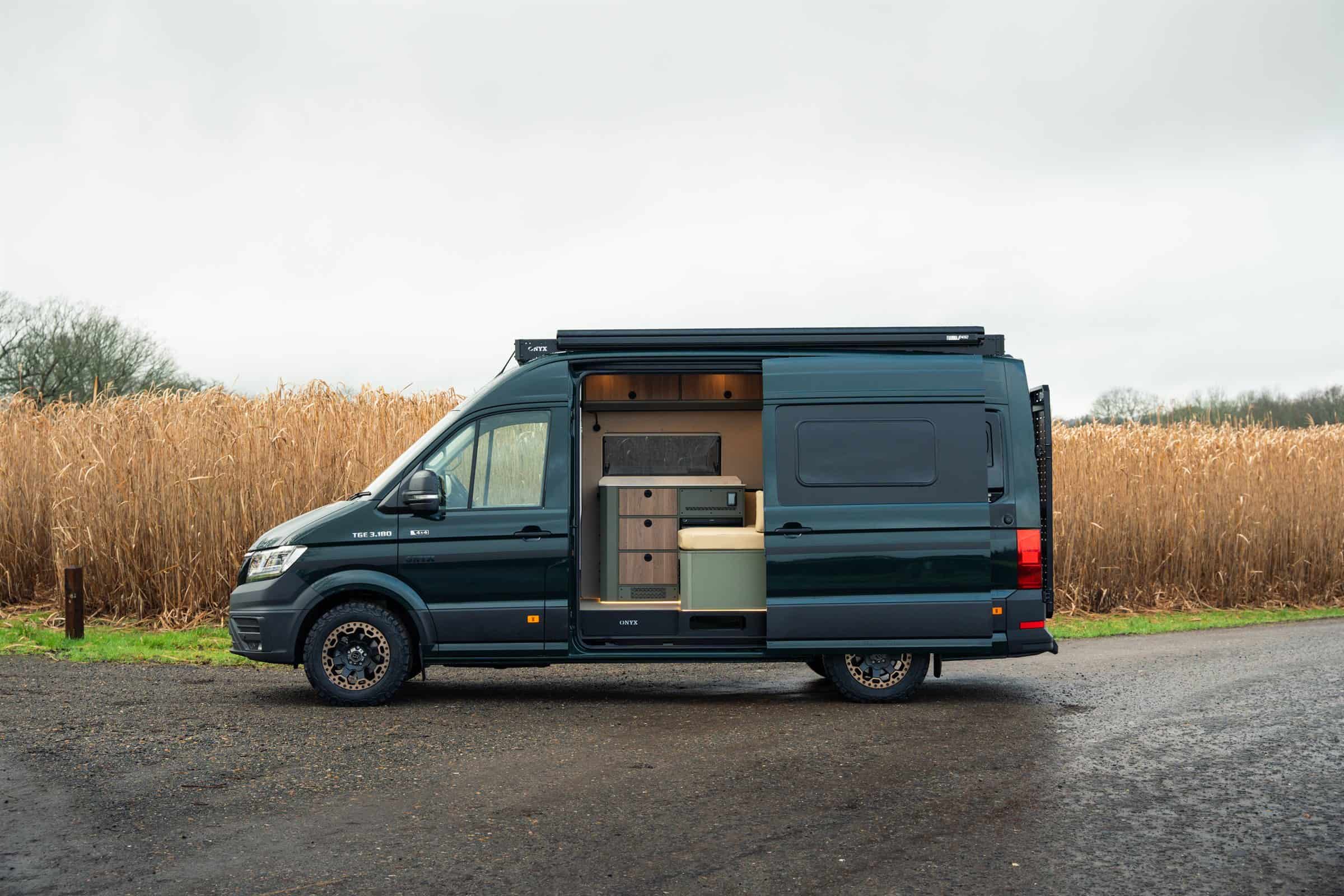 The Onyx Summit beside a cornfield with the side door open