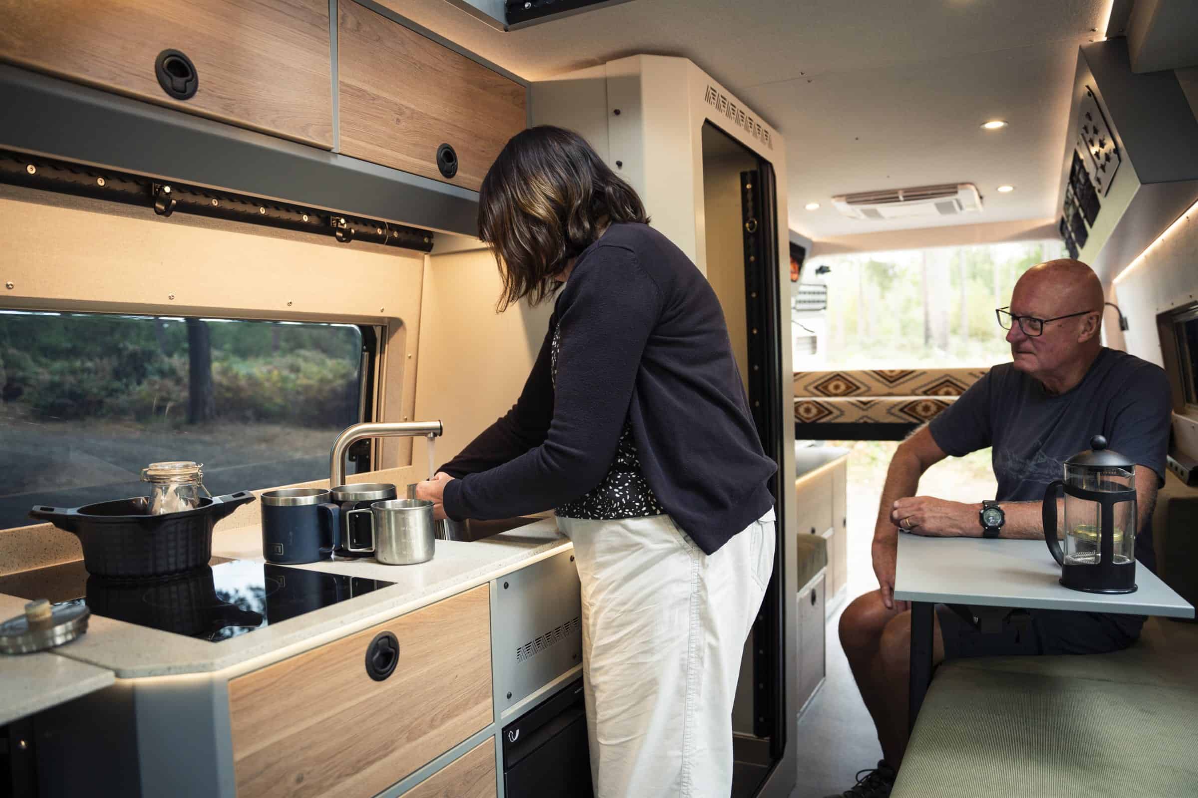 Cooking and sitting at the table inside the Onyx Arête