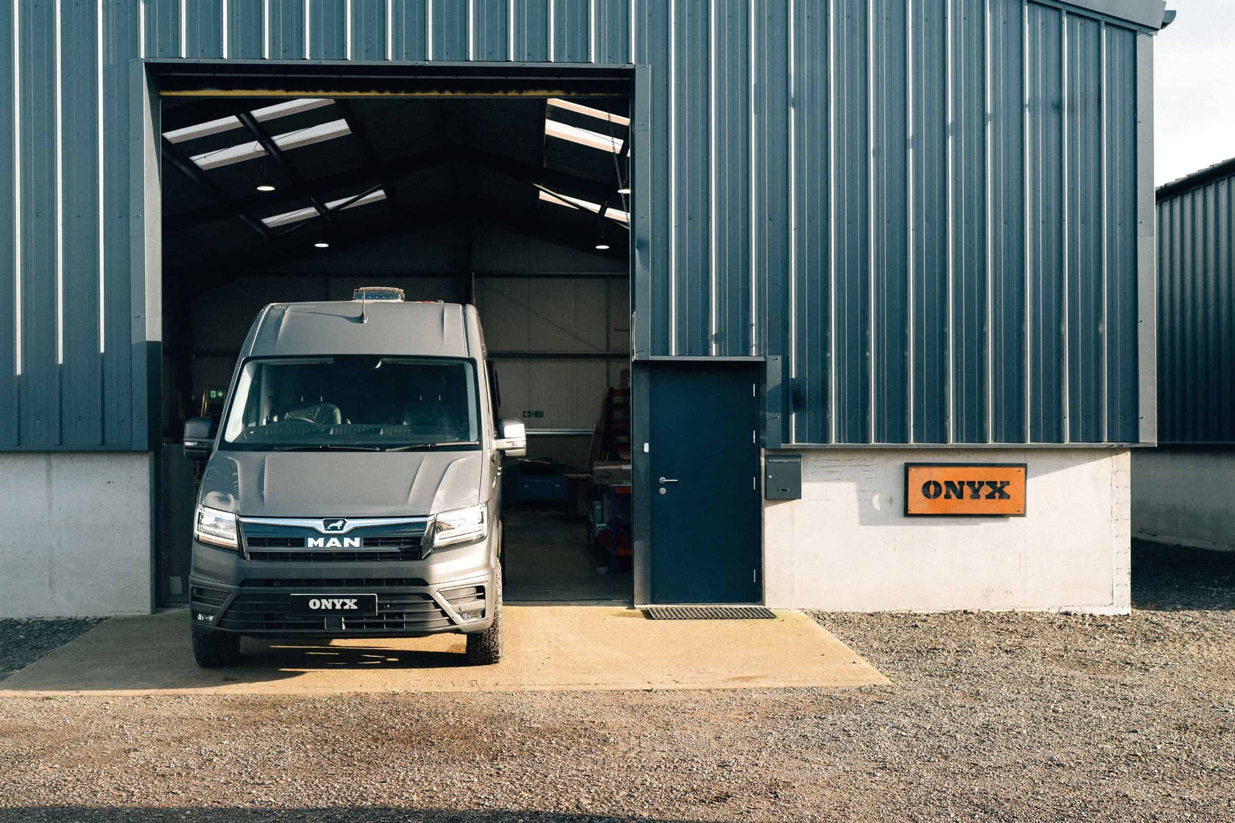 The Onyx Vans workshop in West Sussex, with a MAN TGE in the doorway