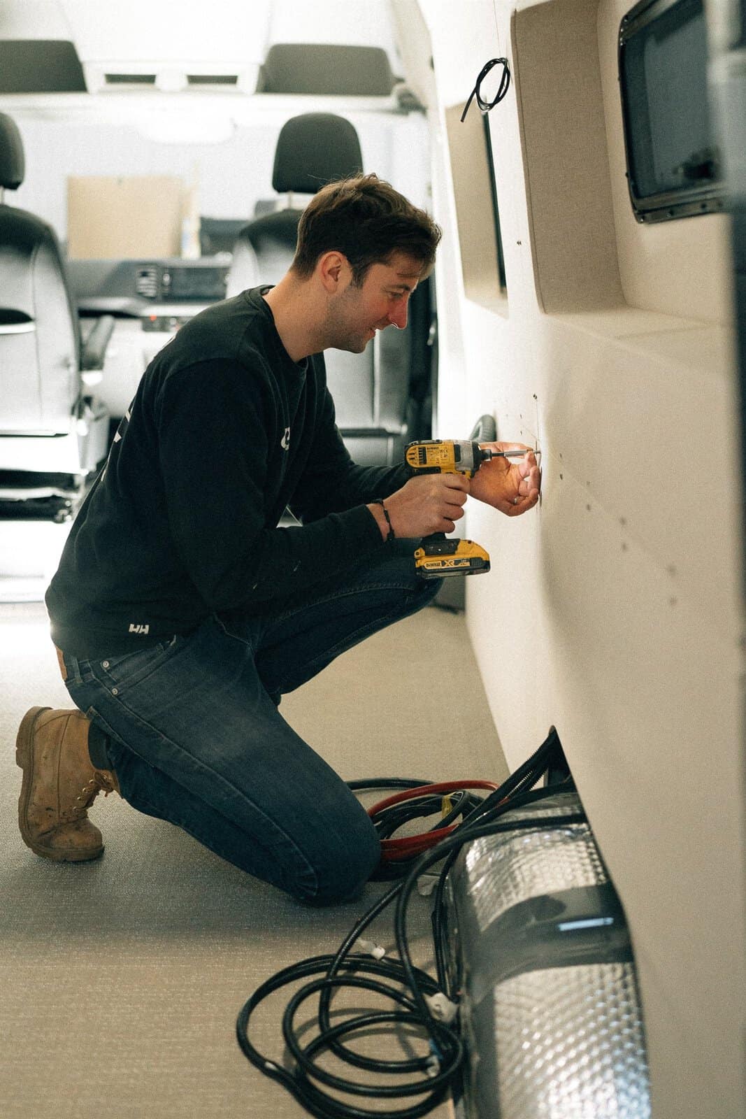 Chris, co-founder of Onyx Vans, fitting out a MAN TGE at the West Sussex workshop
