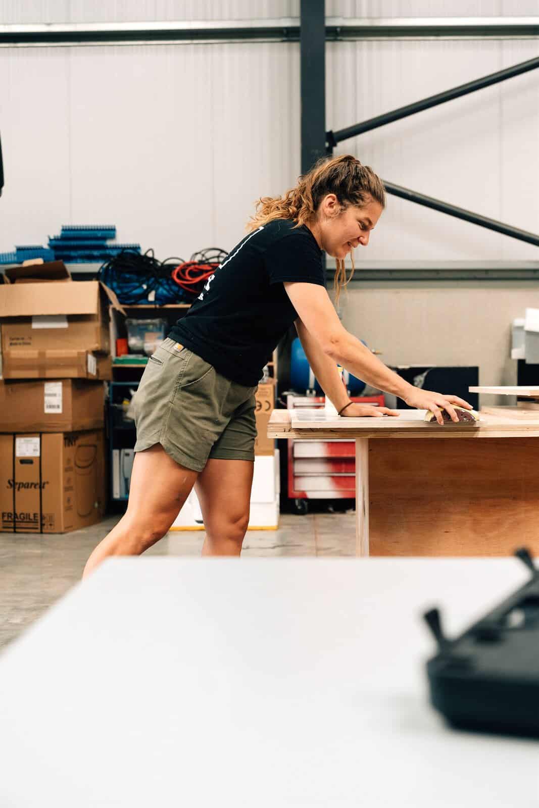 Heather, co-founder of Onyx Vans, working at the bench in the West Sussex workshop