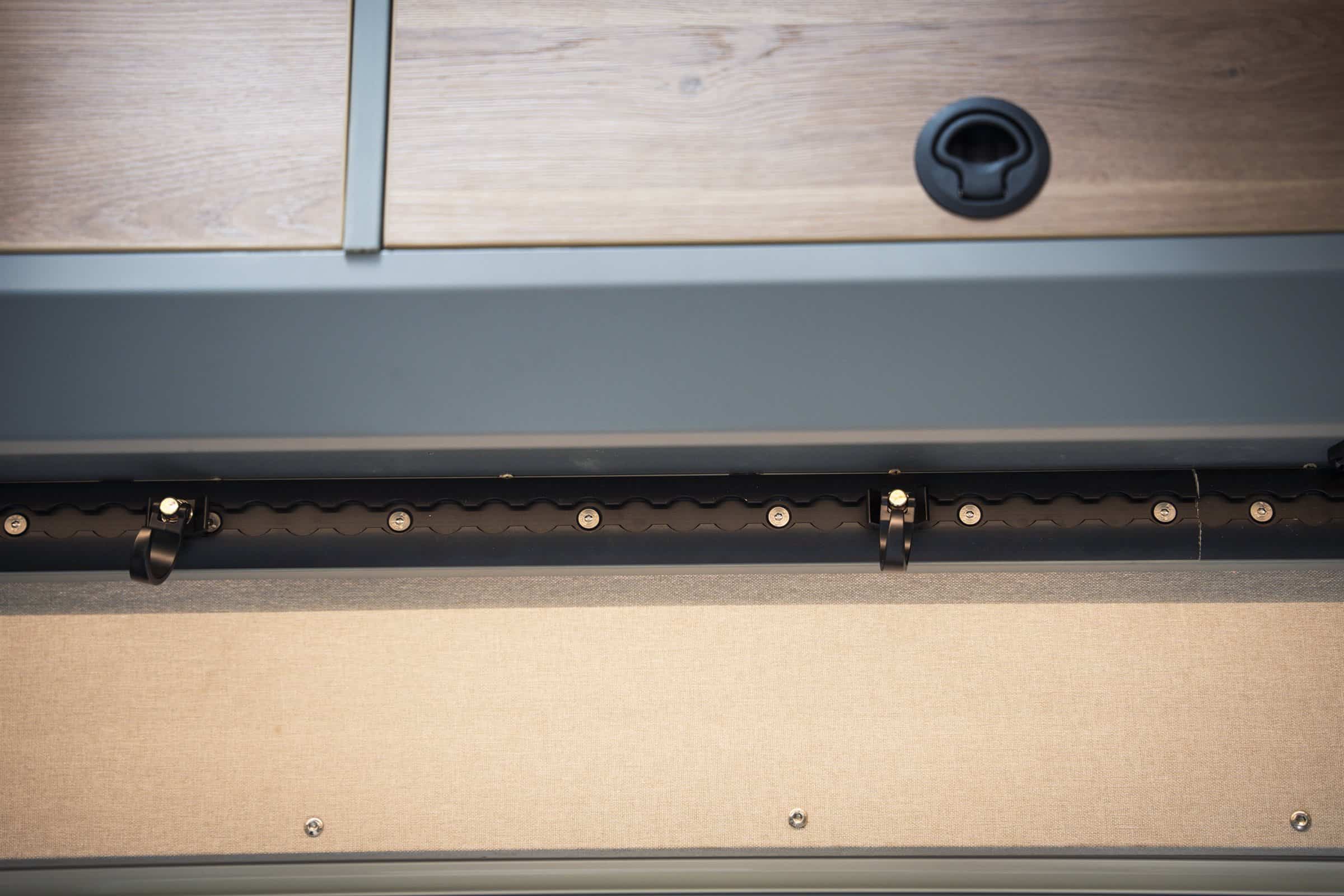 HPL furniture with powder-coated aluminium corners and L-track in the Onyx Mesa