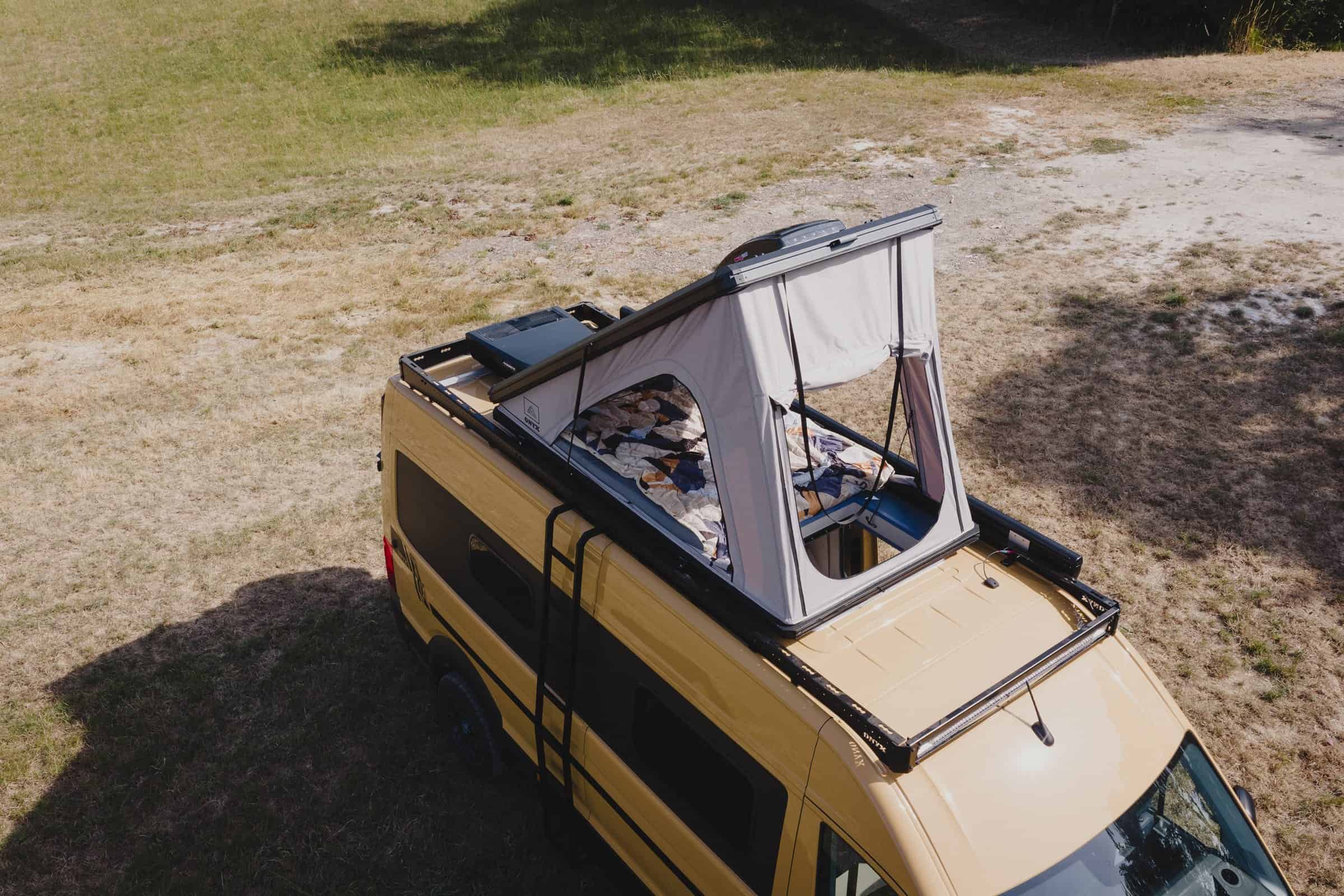 The Onyx Mesa from above with roof rack, solar panel and the pop-top raised