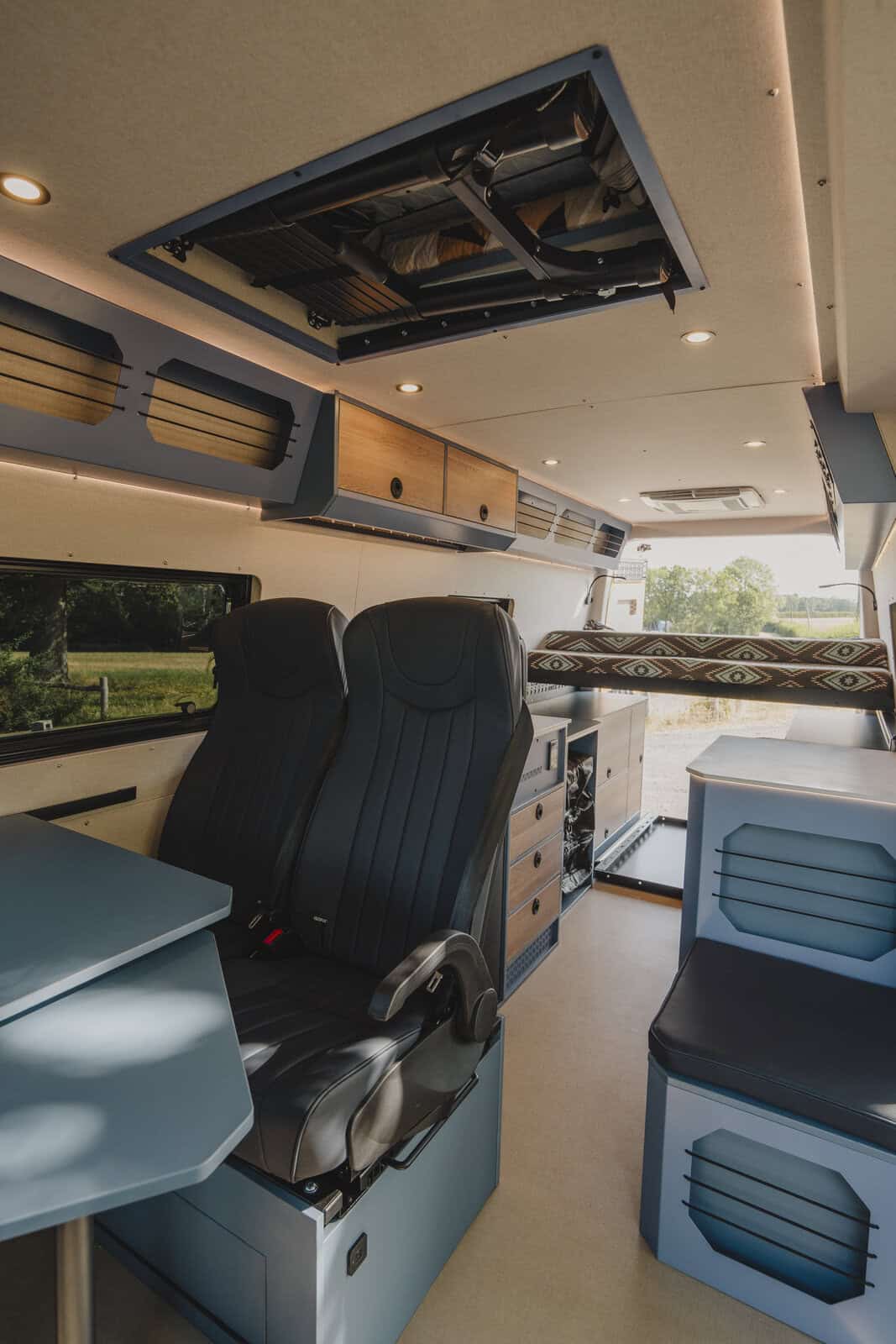 Rear belted travel seats and pop-top berth in the Onyx Outpost campervan