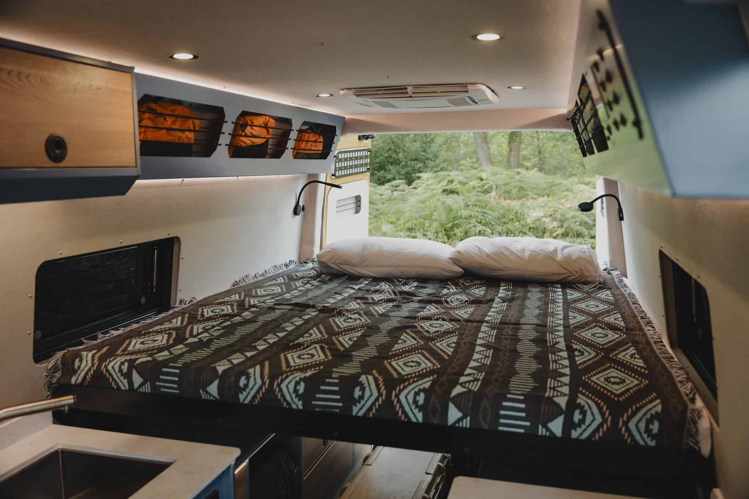 The sliding bed opening up the living area in the Onyx Outpost campervan