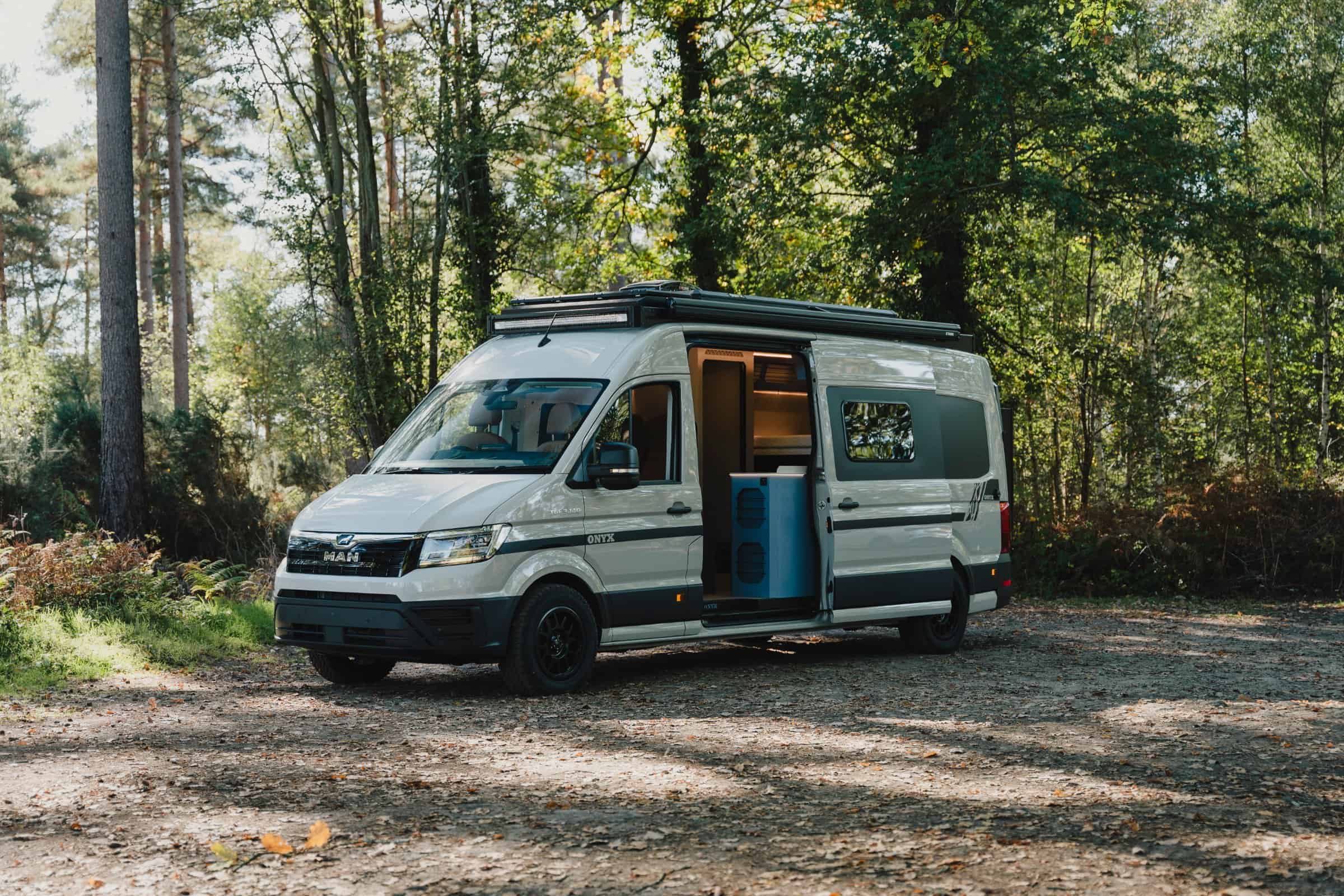 The Onyx Mesa from the front three-quarter in woodland with the pop-top down