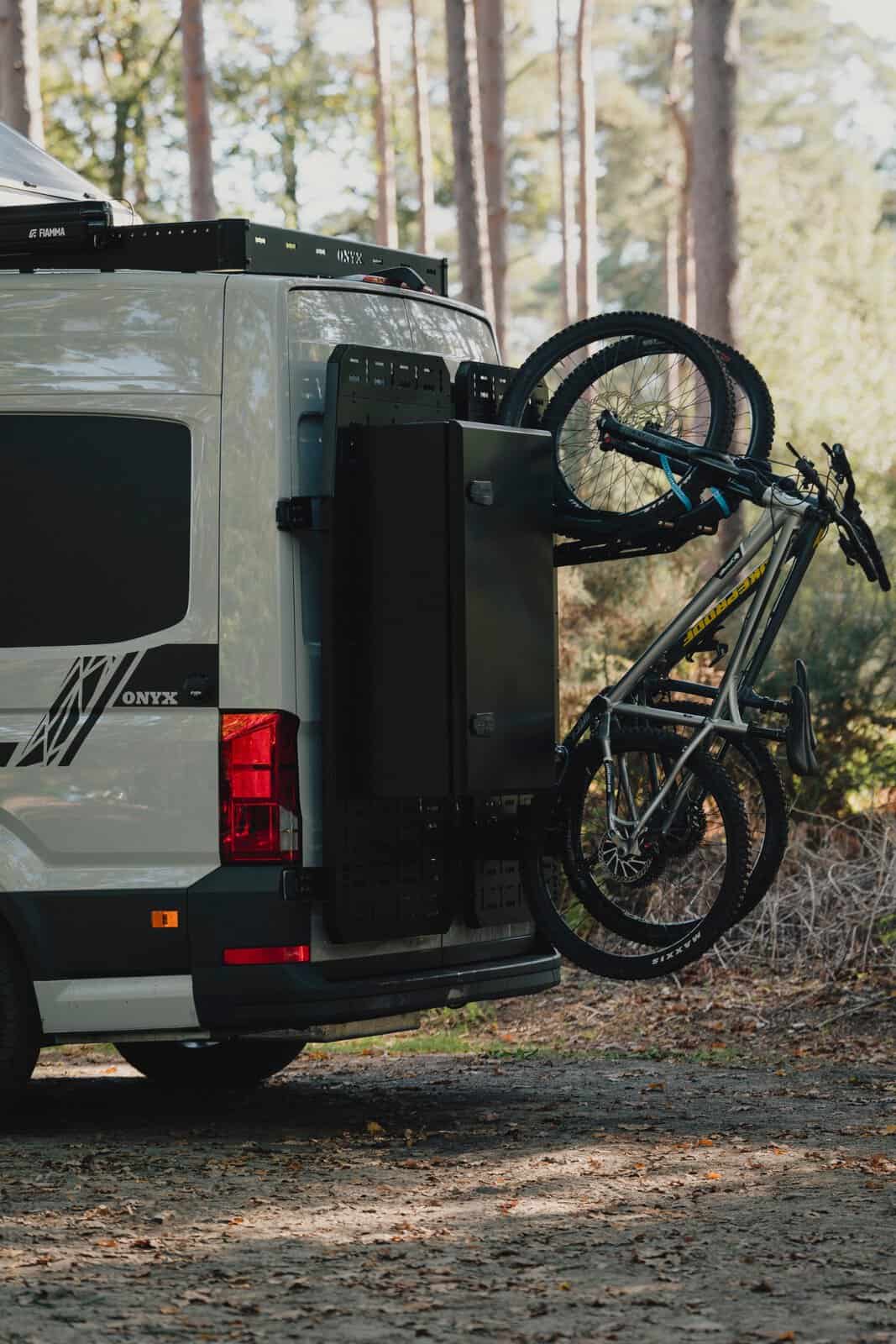 The rear of the Onyx Mesa with rear carriers, storage box and two bikes on the bike racks