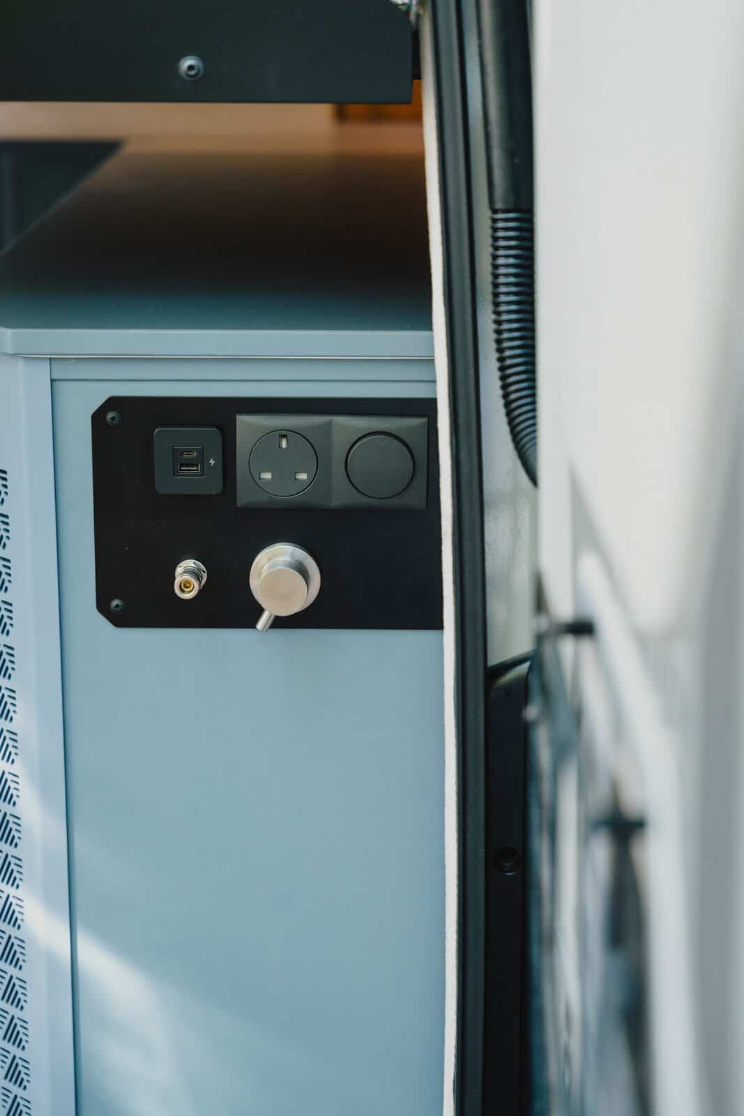 Outdoor shower connection and power sockets at the rear of the Onyx Mesa