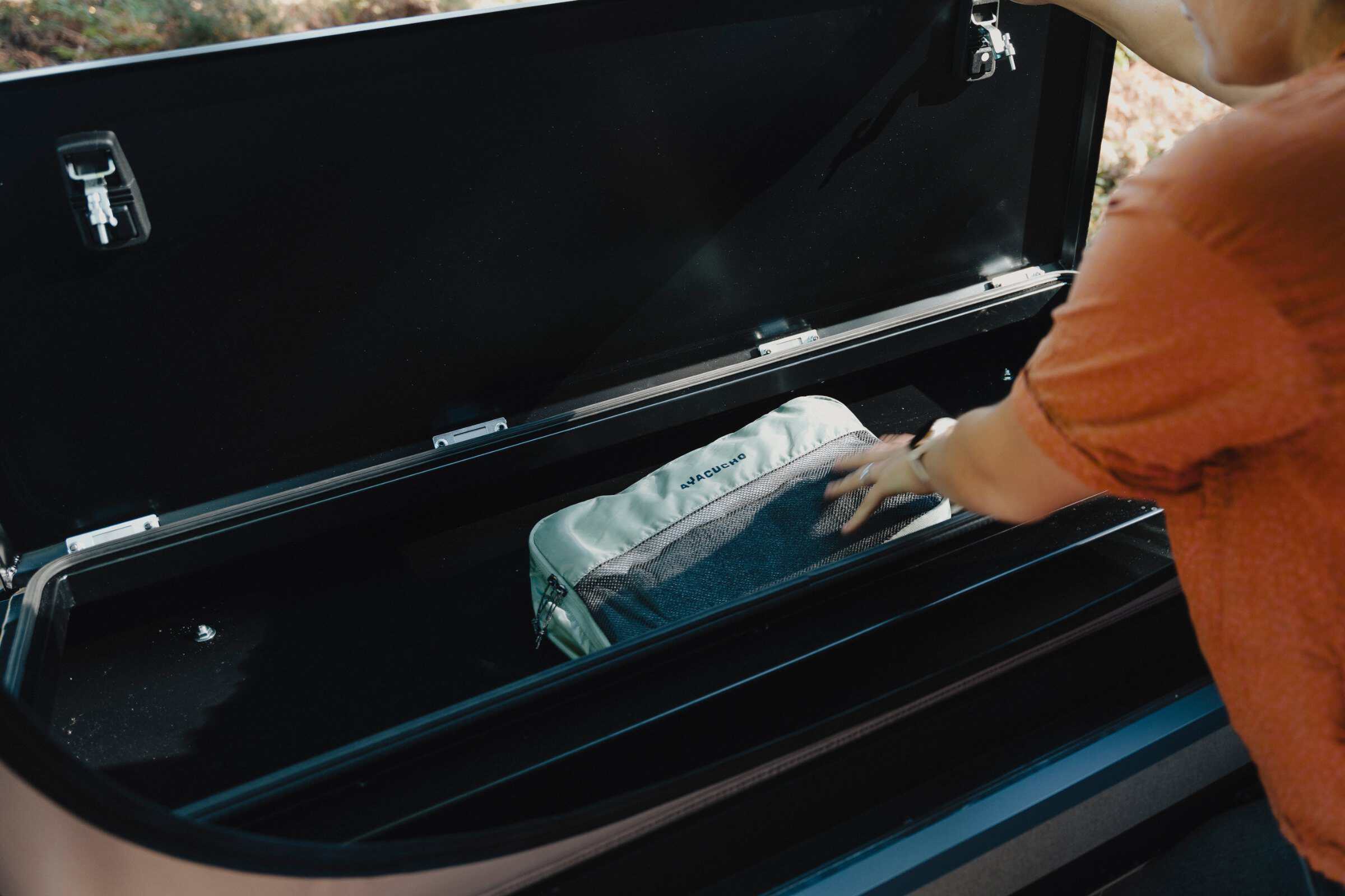 Packing the front storage box on the roof rack of the Onyx Mesa