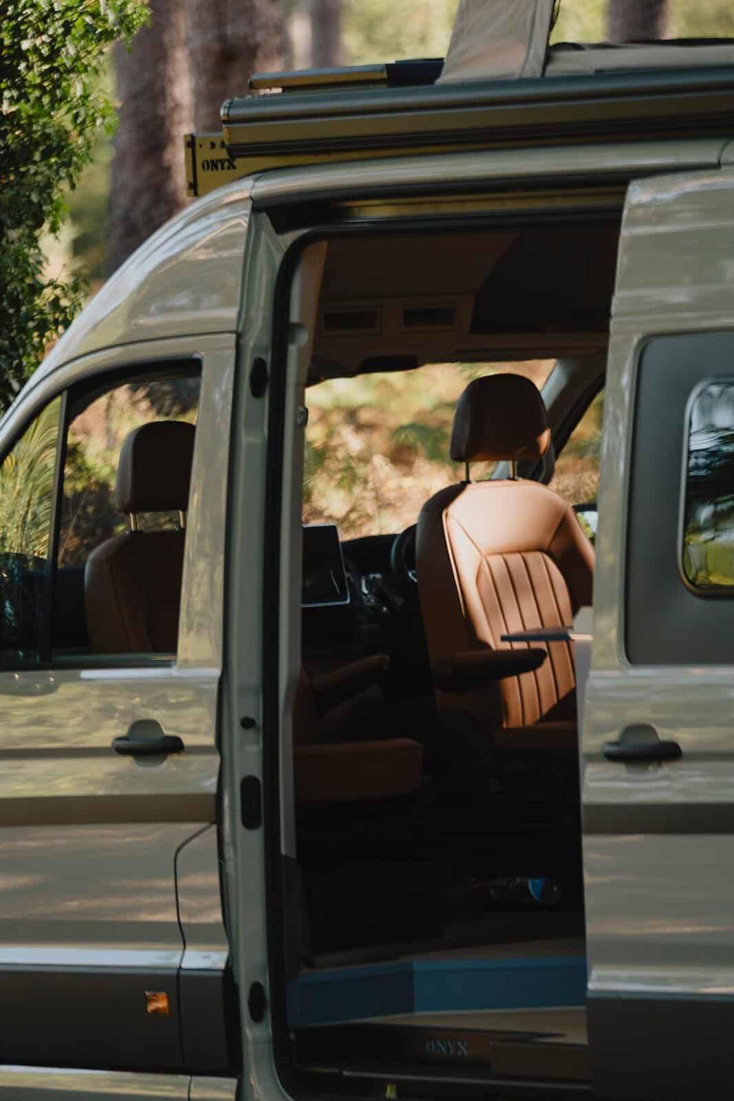 Looking in through the open side door of the Onyx Mesa at the leather cab seats